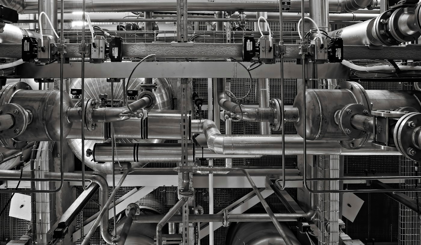 Industrial steam piping and valves in a process plant